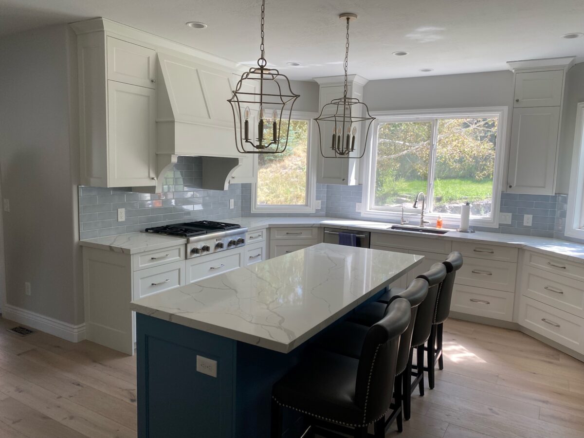 White Kitchen with Blue Island Hood